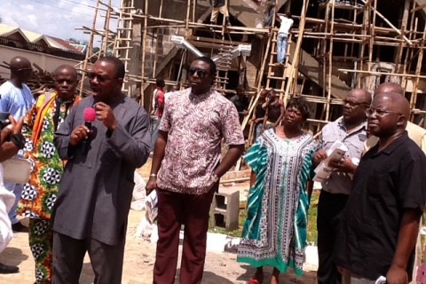 Gov. Peter Obi(with Microphone) and his SSA on Creative Media, Bobmanuel Udokwu   with members of Achebe's family during the inspection of Chinua Achebe's  final resting place in his compound, Ogidi today