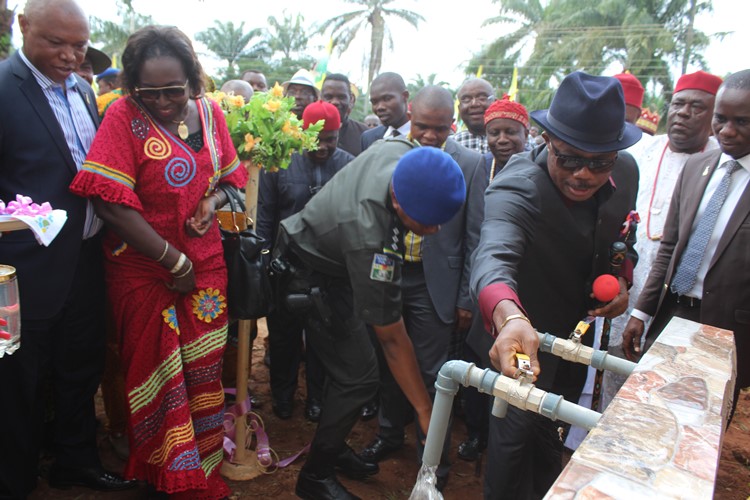 Anambra State governor Chief Willie Obiano opens the taps