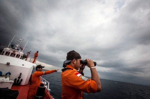 Indonesian national search and rescue agency personel watch over high seas during a search operation for missing Malaysia Airlines flight MH370 in the Andaman Sea on March 15, 2014. Investigators now believe a Malaysian jet that vanished was commandeered by a "skilled, competent" flyer who piloted the plane for hours, a senior Malaysian military official said on March 15 as Prime Minister Najib Razak prepared to address the nation. Photograph by: CHAIDEER MAHYUDDIN , AFP/Getty Images