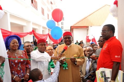 Prof. Onyebuchi Chukwu, Minister of health cutting the tape to inaugurate the Abia state Eye centre in Umuahia. with him from his immediate left are Gov. Theodore Orji of Abia state his wife Mercy and Dr. Okechukwu Ogah, Abia state commissioner for health among other state functionaries.