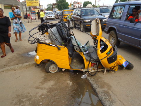 The crushed tricycle at the scene of the accident