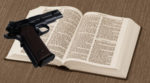 pistol-gun-on-Bible