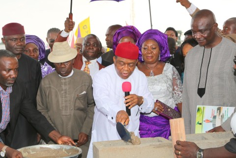 Gov. Theodore Orji of Abia state laying the foundation stone of the new world class event centre in Umuahia. with him from L-R are Rt. Hon. Ude Okochukwu, speaker state house of assembly, Sir Emeka Ananaba, deputy governor, Lady Mercy Orji, wife of the governor and Engr. Ndubisi Mbaka M/D Trademore Investments