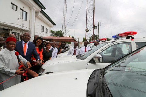 Abia state governor Theodore Orji cutting the tape to inaugurate the 10 state of the art security vehiches donated to the state government by Zenith Bank plc in Umuahia. with him are Dr. Augustine Njoku, General manager group zonal head south-south and south-east of Zenith bank plc and other sfaffs of the Bank