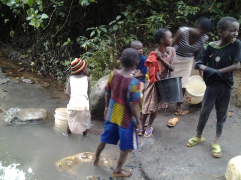 Residents of Bunker, Ngenev, Obed camp scoop water from abandoned coal mines