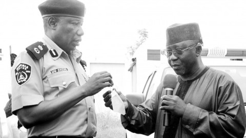 Nasarawa-State-Governor-Tanko-Al-Makura-handing-over-keys-of-patrol-vehicles-to-the-Commissioner-of-Police-Mr.-Umar-Shehu-during-the-donation-of-operational-vehicles-to-security-agencies-in-the-state-in-Lafia