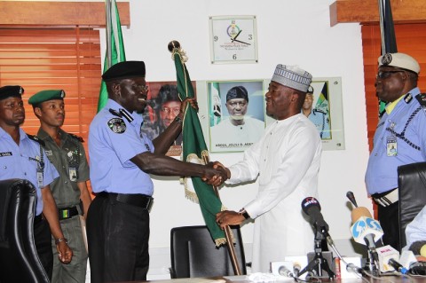 IGP Suleiman Abba Receiving the Nigeria National Flag from his Predecessor