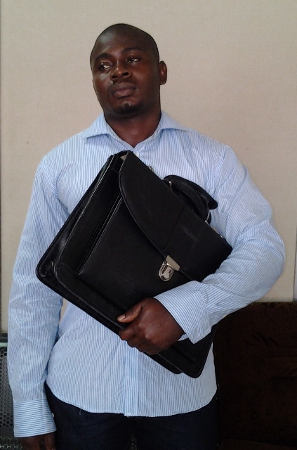 agu ifeanyi kingsley with the laptop bag containing   cocaine