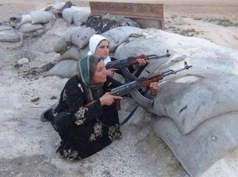 This photo was tweeted with the caption: "Kurdish family vs ISIS terorist in Kobane. Kurds in Kobane need help!"