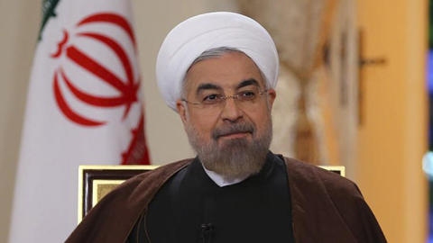 Iranian President Hassan Rouhani, shown on state-run TV in Tehran on Oct. 13, has reportedly directed Iran's oil ministry to seek a meeting of the Organization of Petroleum Exporting Countries cartel next month to discuss propping up oil prices. (Mohammad Berno / Associated Press)