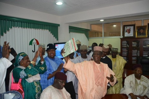  Sen Haruna Zego Aziz displaying his nomination and expression of interest forms to supports shortly after he picked the forms at the PDP National party secretary in Abuja 