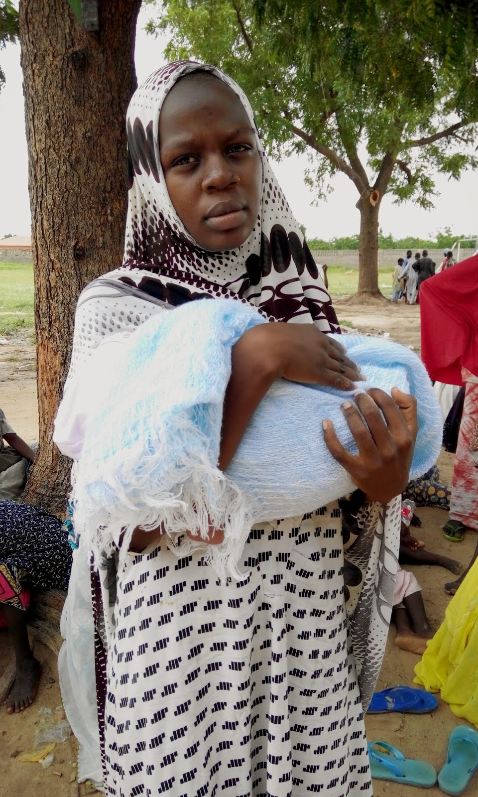 A young house-wife who delivers her baby boy in camp after fleeing Boko Haram attack in Bama