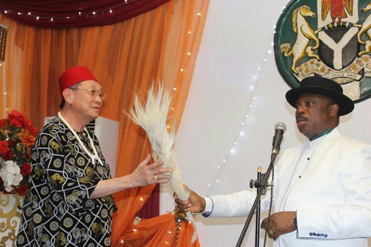 His Excellency Governor Willie Obiano and Dr.Dusit a member of the Thai Delegation exchanging traditional Igbo greeting for titled-men during the Cultural Night held at Governors Lodge Amawbia 
