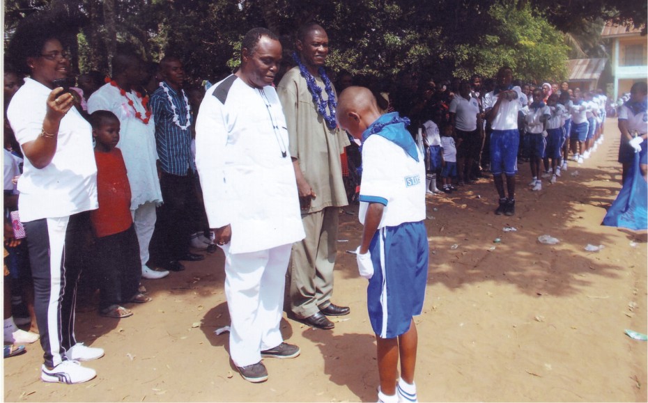 Pupils-of-St.-Linus-Schools-performing-during-an-Inter-schools-March-Past-Competition.-The-Leader-of-the-group-bows-to-the-officiating-dignitaries.