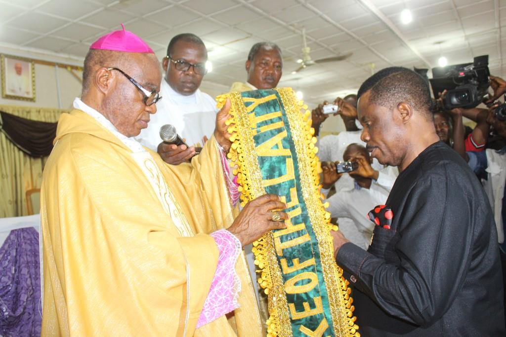 Most Rev. Valerian Okeke, Archbishop of Onitsha Catholic Diocese conferring the title DUKE on Chief Willie Obiano, Governor of Anambra State as part of the ceremony marking the 40th Anniversary of the Catholic Laity Council of Nigeria in Onitsha...Saturday