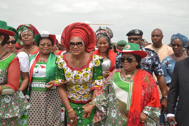 Wife of the Governor of Anambra State, Chief (Mrs.) Ebelechukwu  Obiano welcoming Mama Peace and First Lady of Nigeria, Dame Patience Jonathan on arrival for the Women Rally in Onitsha