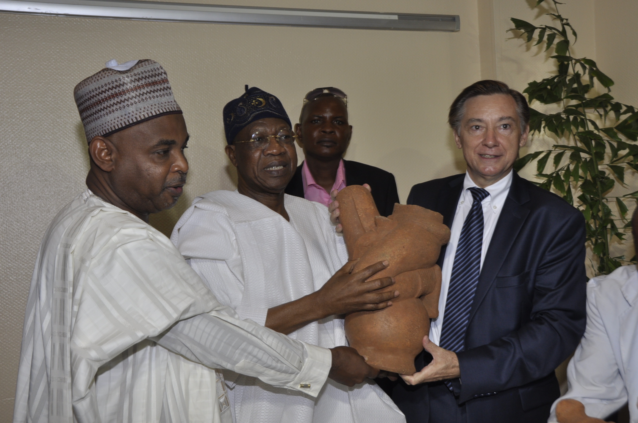 French Ambassador to Nigeria, Mr. Denys Gauer presenting the Nok Terracotta to the Minister of Information and Culture, Alhaji Lai Mohammed and the Director General, National Commission for Museums and Monuments, Yusuf Abdallah, at the 2016 International Museums Day Celebration in Abuja on Wednesday.