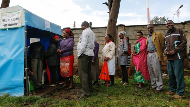 Kenyan voters queue as they wait to cast their votes in Huruma, one of the ruling party Jubilee