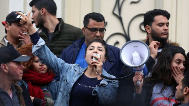 A demonstrating graduate shouts slogans during protests against rising prices and tax increases, in Tunis, Tunisia January 9, 2018