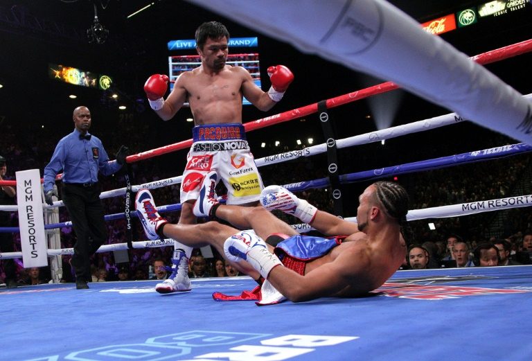 Brilliant Pacquiao downs Thurman to capture WBA crown