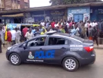 police-team-and-crowd-trying-get-a-glimpse-of-the-mtn-driver