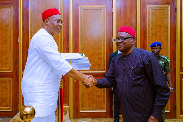 Governor Hope Uzodimma of Imo State receives report on the recovery of land belonging to the Alvan Ikoku Federal College of Education Owerri from the Chairman of the Committee, Prof. Vitalis Orikeze Ajumbe at the Government House Owerri... Tuesday.