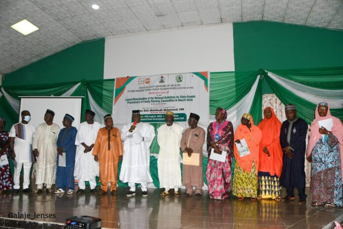 Group photograph of government officials and representatives of donor partners during the launching of National guidelines and dessimination for state-funded procurement of family planning commodities documents in the state