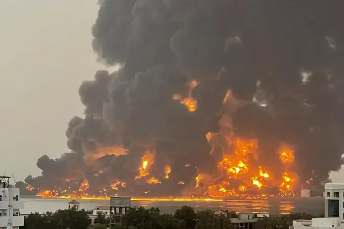 Fire erupts after air strikes on the Yemeni port city of Hodeidah on July 20, 2024 [Handout/Ansarullah Media Centre via AFP]