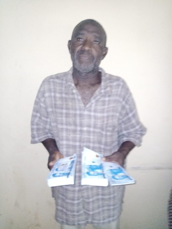 Police arrest 62 year old suspect with suspected counterfeit notes