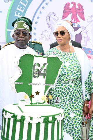 President Bola Tinubu and First Lady, Senator Oluremi Tinubu, cutting the independence anniversary cake at the Independence Day Parade.