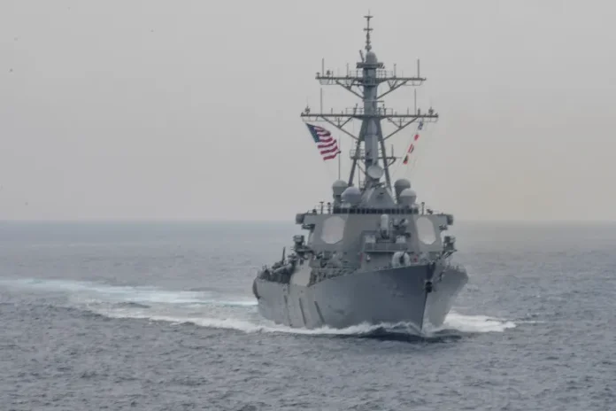 Iranian helicopter confronts US warship approaching territorial waters