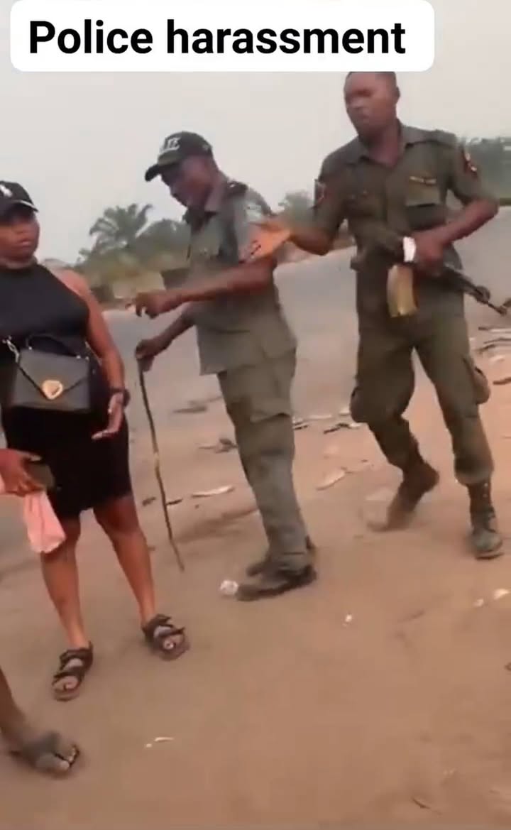 Outrage As Video Captures Police Officer Cocking Gun And Calling Woman "Ashawo" During Lagos Clash